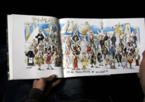 Un hombre observa un libro con dibujos de Antonio Mingote. Un hombre observa un libro con dibujos de Antonio Mingote.