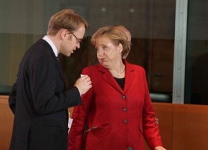 Weidmann (del Bundesbank) y la canciller alemana Merkel