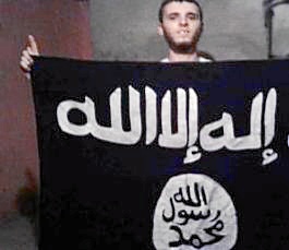 Mohamed Abdeselam Mohamed posando con símbolos yihadistas