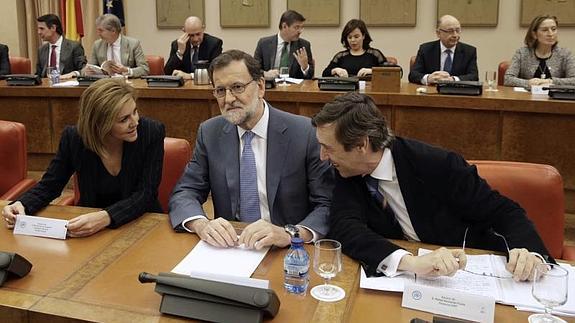 Cospedal, Rajoy y Hernando. 