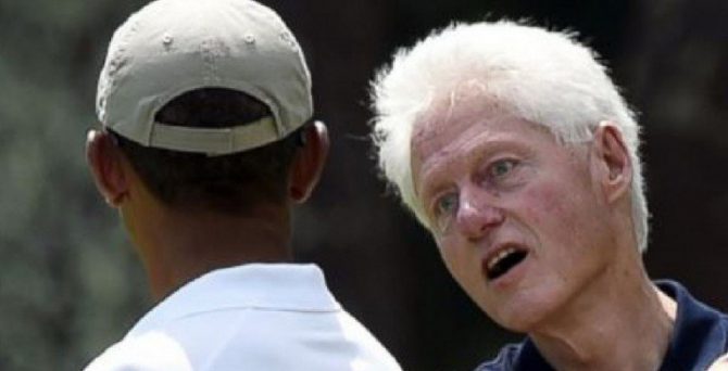 Bill Clinton, junto a Obama.