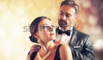stock-photo-a-man-gives-a-necklace-to-his-wife-213271270.jpg